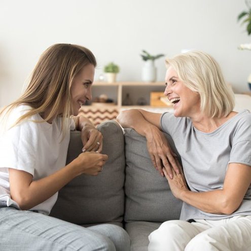 Ladies converse on couch