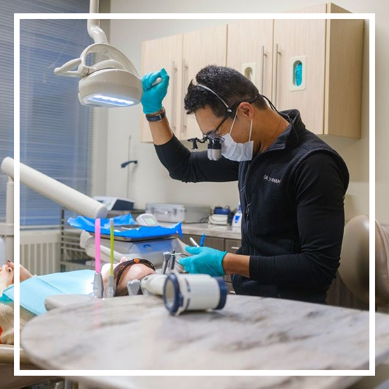 Doctor Kham performing a dental checkup on a patient
