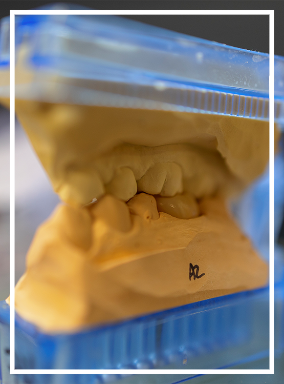 Man smiling in a dental office after gum disease treatment in Washington, DC